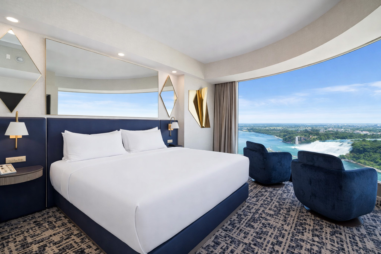Premium king bedroom with curved corner window and falls views