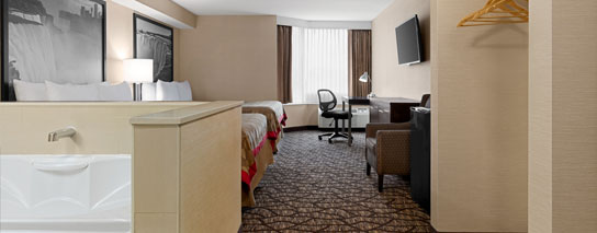 Two queen bed whirlpool suite room at Ramada by Wyndham Niagara Falls Near The Falls