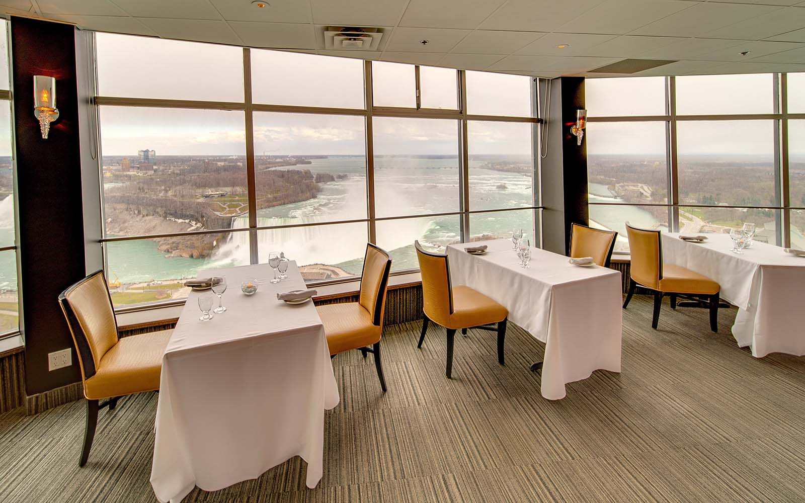 Sky Fallsview Steakhouse dining room with panoramic windows