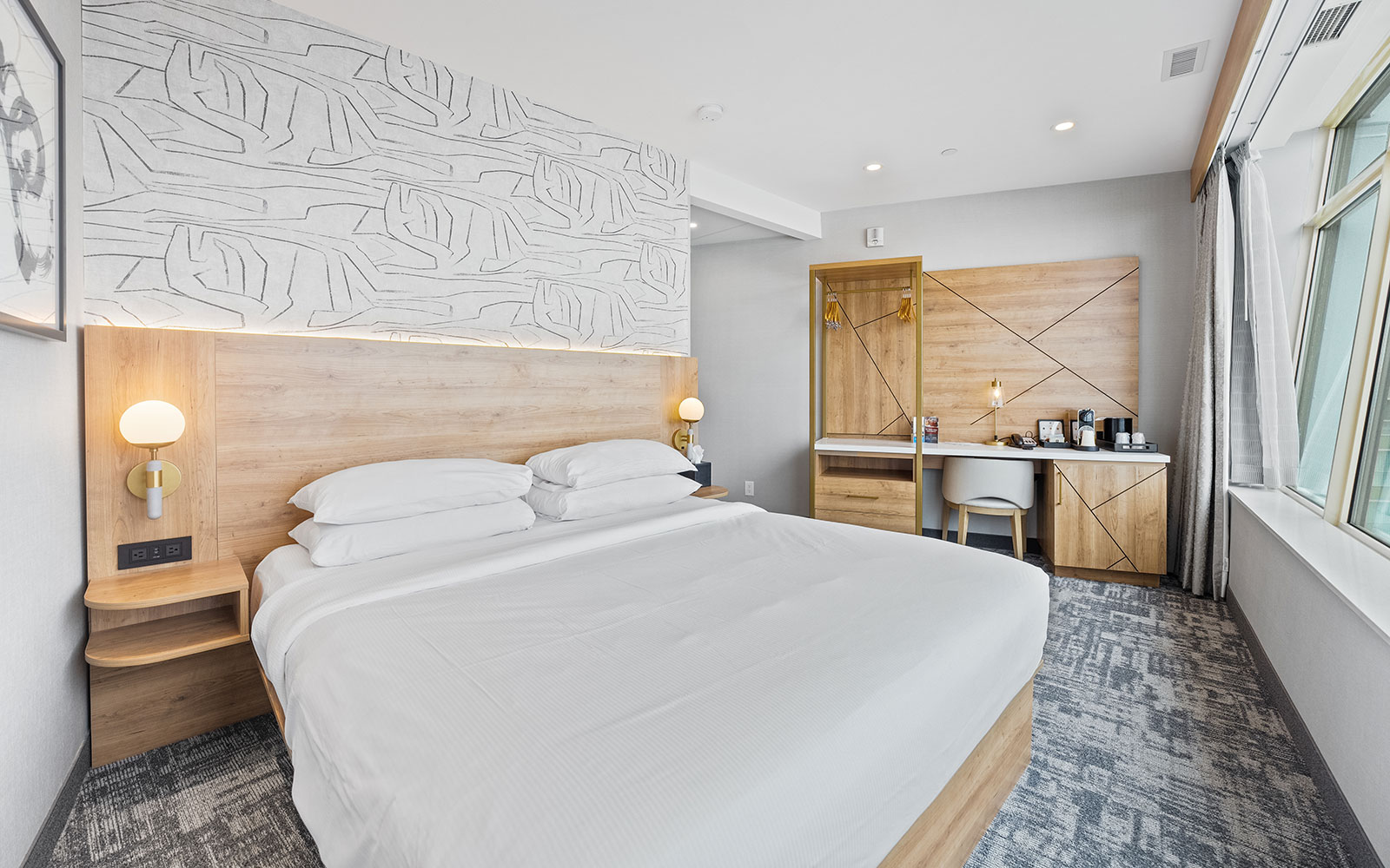 High-angle Niagara Falls panorama framed by guestroom windows