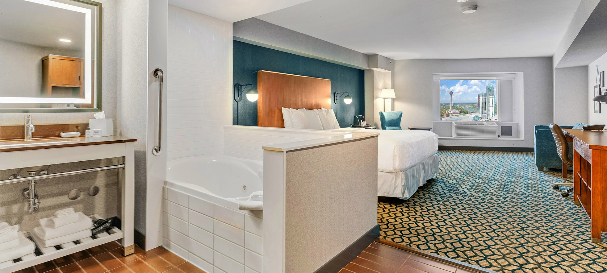 Whirlpool suite with open-plan king bedroom and in-room tub